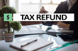 Tax refund text on virtual screen. Business and Finance concept.?