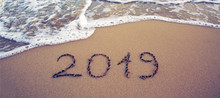 Year 2019 Written At The Caribbean Sand Beach With Sea Wave .