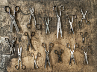 Wall Mural - Antique rusty scissors rustic wooden background Vintage accessories