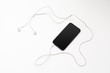 © fotofabrika - Creative flat lay photo of workspace desk with earphones and mobile phone
