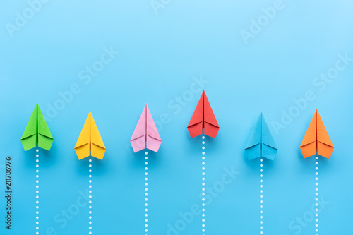 Cuadros en Lienzo Paper plane on blue background, Business competition concept.