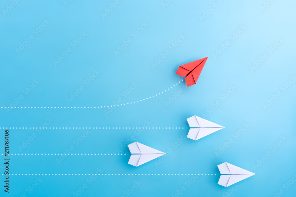 Group of paper plane in one direction and with one individual pointing in the different way. Business concept for new ideas creativity and innovative solution. - obrazy, fototapety, plakaty 
