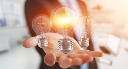 Poster - Businessman connecting modern lightbulbs with connections 3D rendering