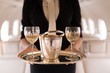 © Wavebreak Media - Flight attendant serving glasses of champagne in private jet