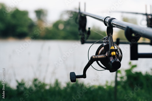 Cuadros en Lienzo Fishing on the summer lake with fishing rod