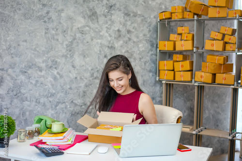 Fotografie, Obraz Business owner, Beautiful girl who works at home and pack your order to the customer, Smile happily