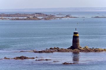 Wall Mural - Beacon on the coastline of Saint-Quay-Portrieux, commune in the Côtes-d'Armor department of Brittany in northwestern France.