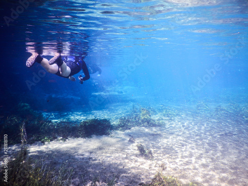Cuadros en Lienzo Practicing diving and snorkeling, mysterious lagoon, beautiful lagoon of transpa