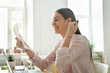 © fizkes - Happy female worker excited getting business letter with promotion news, satisfied woman celebrating corporate success reading report with great result or personal achievement. Rewarding concept