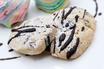 Cookies closeup with chocolate chips snack in a black background delicious biscuit pastry detail fruit plate muffin bakery tasty breakfasy dessert piece snack cake food 