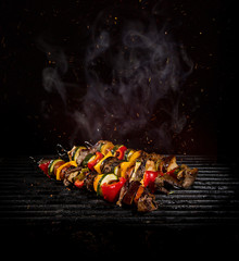 Wall Mural - Chicken skewers on the grill with flames