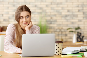 Poster - Teenage girl with laptop studying indoors