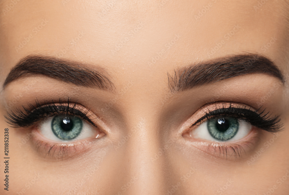 Young woman with beautiful eyebrows, closeup