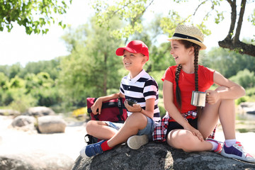 Sticker - Little children with traveling gear outdoors. Summer camp