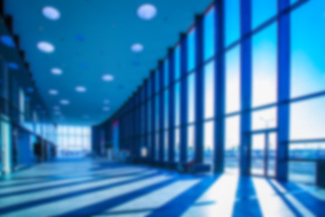 Poster - The building is long. The long hall. Panoramic windows. The sun shines through the high windows. Background.
