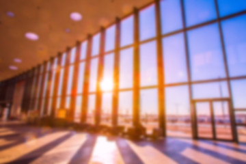 Poster - The building is long. Background for a business concept. The long hall. Panoramic windows. The sun shines through the high windows. Background.