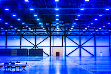 Poster - Empty warehouse. Many lamps on the ceiling. Empty space.