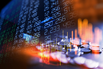 Poster - double exposure image of stock market investment graph and coins stack.