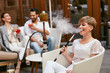 © puhhha - People Smoking Shisha, Drinking Cocktails In Hookah Bar