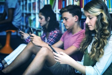 Poster - Students using mobile phone in library