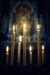 Seven candles in the Christian Church on the icon background. Abstract concept background on religion and philosophy topics. Retro style.