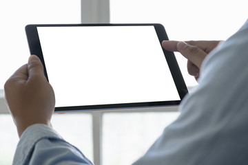 Poster - Digital tablet computer close up man using tablet hands man multitasking with isolated screen