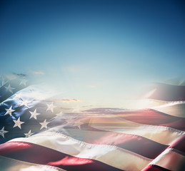 american flag over a beautiful sunset or sunrise.