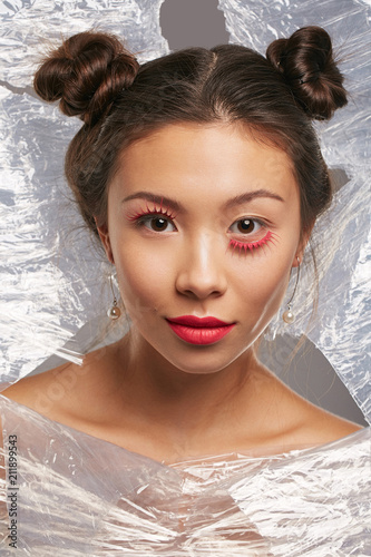 Conceptual Portrait Of A Young Asian Beauty Her Head Peeking Out