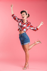 Poster - Happy young pin-up woman posing isolated