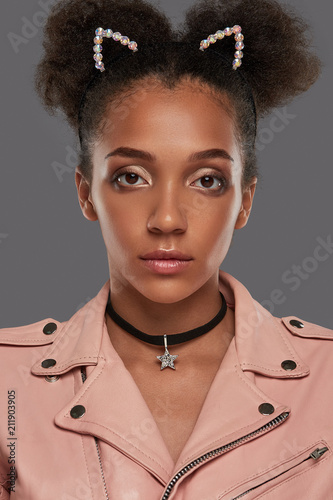 A Close Up Portrait Of A Young African Lady In A Pink Biker Jacket