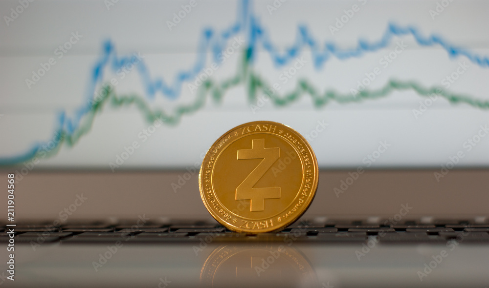 physical Zcash (ZEC) cryptocurrency;  Zcash coin on the background of the chart