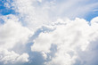 © Alla - White fluffy clouds and sky, background.