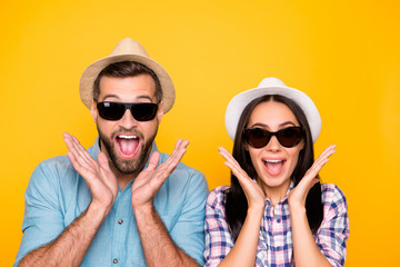 Aufkleber - Head shot portrait of surprised glad traveler in straw hats black eyeglasses with wide open mouth holding palms near face isolated on vivid yellow background