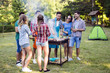 © NDABCREATIVITY - Happy friends enjoying barbecue party