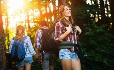 Wall Mural - people trekking in forest