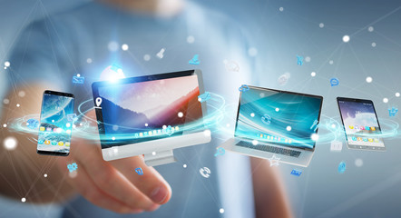 Wall Mural - Businessman connecting tech devices and icons applications 3D rendering