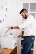 © pablocalvog - Man pressing buttons on a photo copier