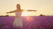 SLOW MOTION: Young Woman Spinning In Beautiful Purple Lavender Field