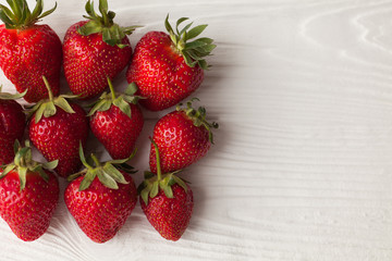 Background from freshly harvested strawberries, directly above. Healthy strawberry isolated on white background. Copy space. Top view, High resolution product.