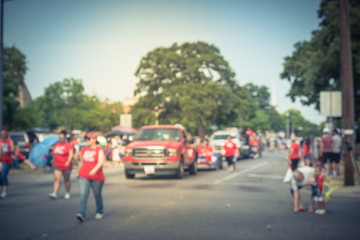 vintage blurred traditional july 4th parade in irving, texas, usa