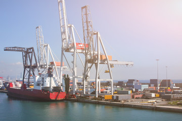 Container ship moored at idustrial cargo port. Export and import water shipping and logistics. Global tradenig