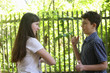 © ulianna19970 - two teenager siblings boy and girl close up photo on country sunny green garden background