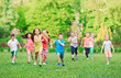 © davit85 - Many different kids, boys and girls running in the park on sunny summer day in casual clothes