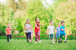 © davit85 - Many different kids, boys and girls running in the park on sunny summer day in casual clothes