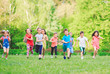 © davit85 - Many different kids, boys and girls running in the park on sunny summer day in casual clothes