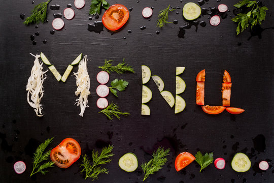 The inscription menu, made with sliced vegetables.