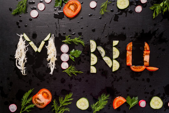 The inscription menu, made with sliced vegetables.
