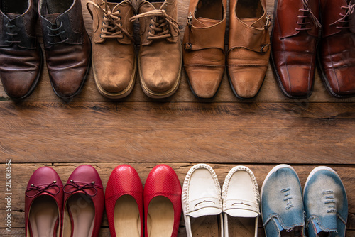 Fotomural shoes with men and women various styles on a wooden floor - lifestyles