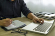© tanasin - Businessman using laptop to the situation on the market value , Business concept