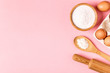 © tbralnina - Ingredients and utensils for baking on a pastel background.